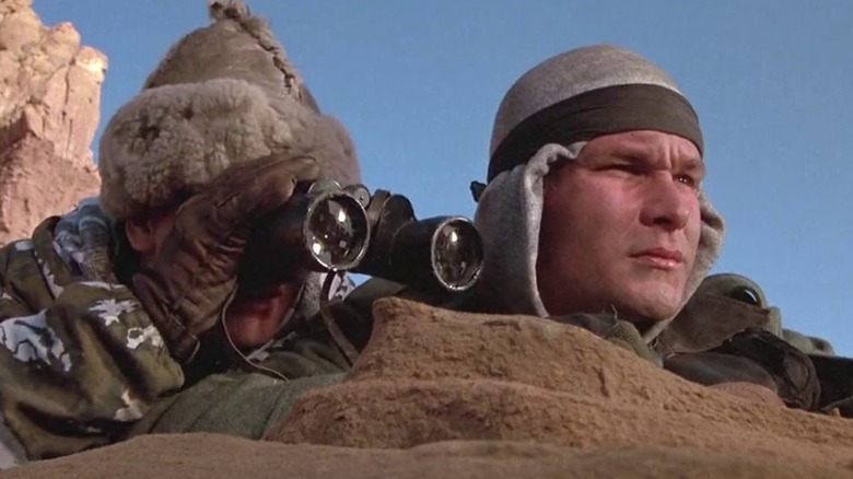 Swayze watches the enemy movements.