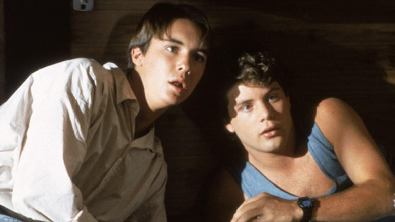 Wheaton and Astin hide from terrorists.