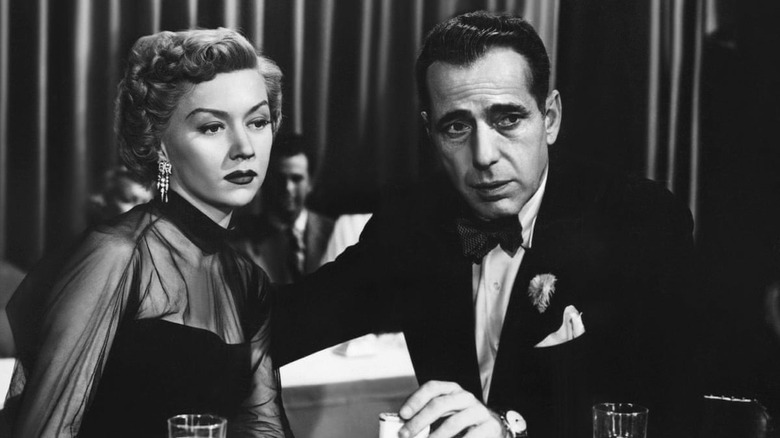 Humphrey Bogart holds Gloria Grahame