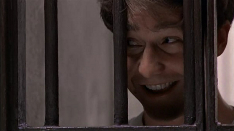 Edward Norton laughs from behind bars