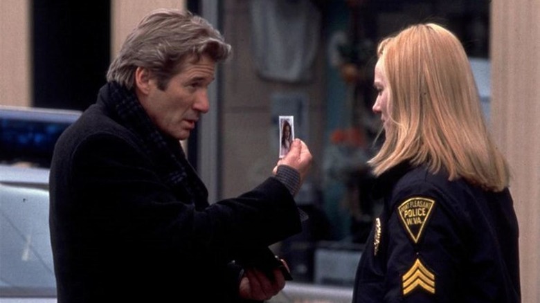Richard Gere shows Laura Linney a picture