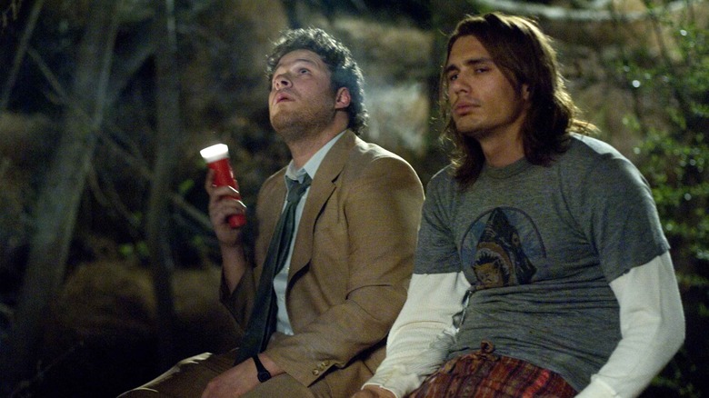 Seth Rogen and James Franco sitting outdoors