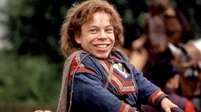 Warwick Davis smiles