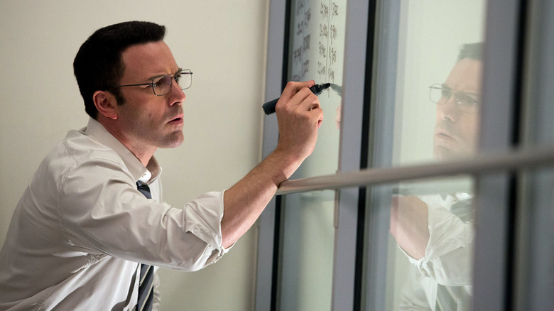 Ben Affleck writing on board