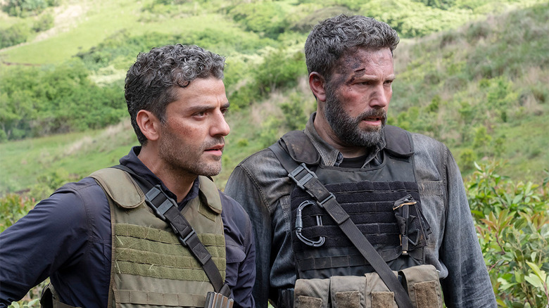Ben Affleck and Oscar Isaac gaze into the distance