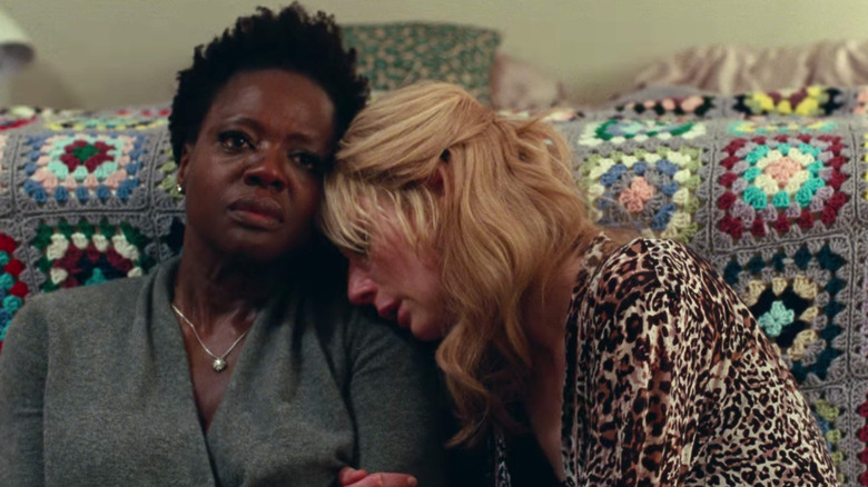 A distraught Elizabeth Debicki leans on Viola Davis 