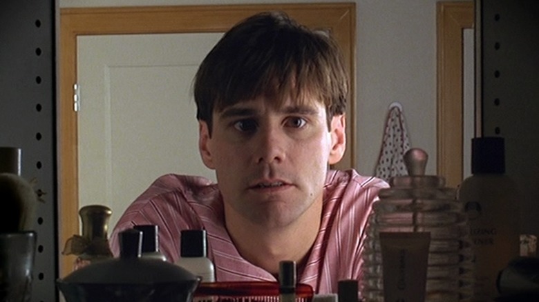 Truman's face surrounded by bathroom products