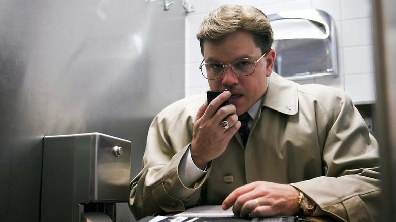 Matt Damon on phone in bathroom