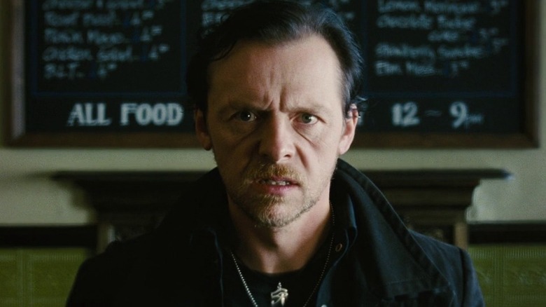 Simon Pegg as Gary King in The World's End, looking disconcertingly straight past the camera.