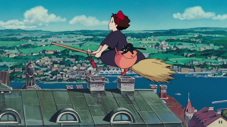 Kiki and Jiji flying above the city 