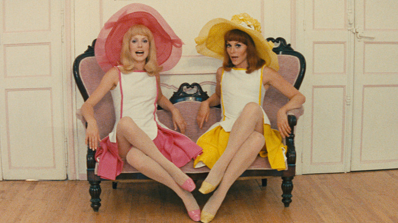 Delphine and Solange singing on a chair