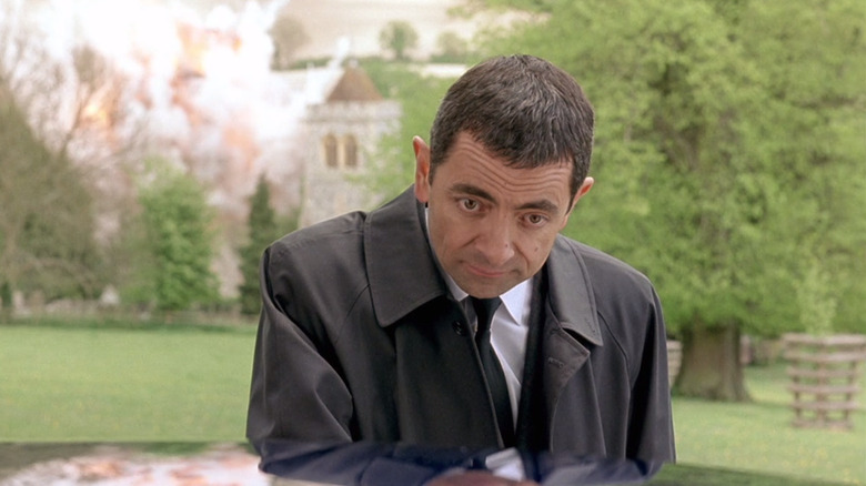 Johnny English not noticing a massive explosion behind him