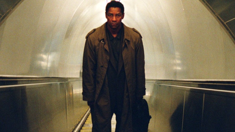Bennett Marco riding an escalator