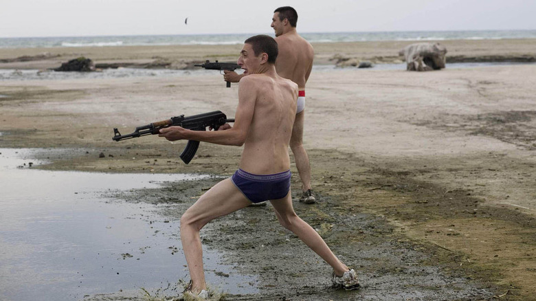 Two men with guns in Gomorrah