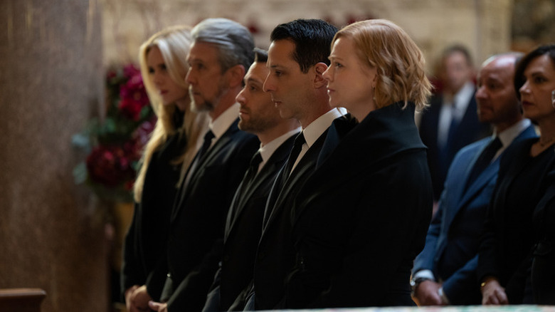 The Roy families standing in a church on "Succession"