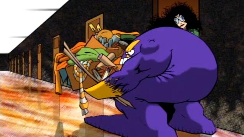 The Maxx carrying a box full of junk in The Maxx