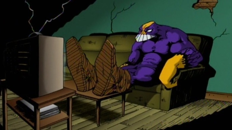 The Maxx watching TV on a couch in The Maxx