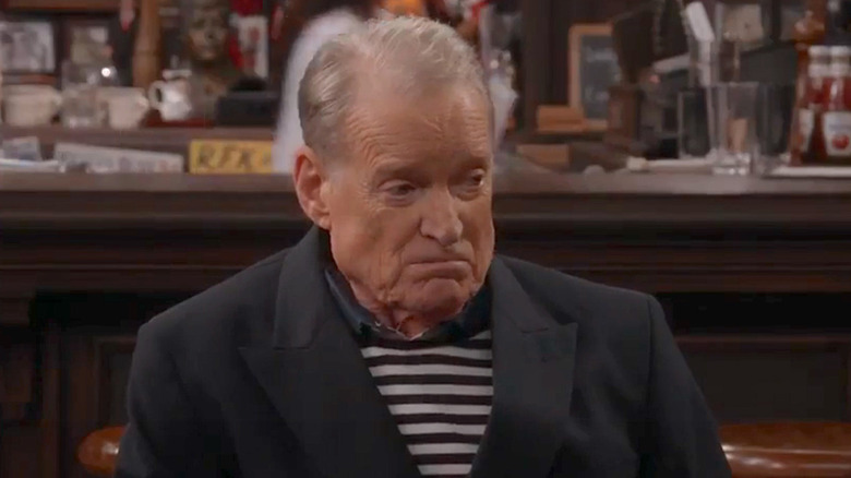 Charles Kimbrough as Jim Dial, smiling at the bar in Murphy Brown