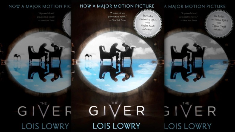 The Giver taking Jonas' hands on the cover of The Giver