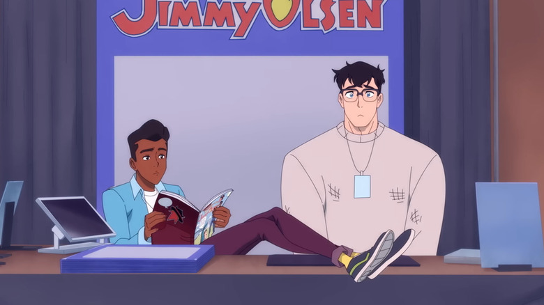 Jimmy calmly reads a comic book while sitting next to Clark in My Adventures With Superman