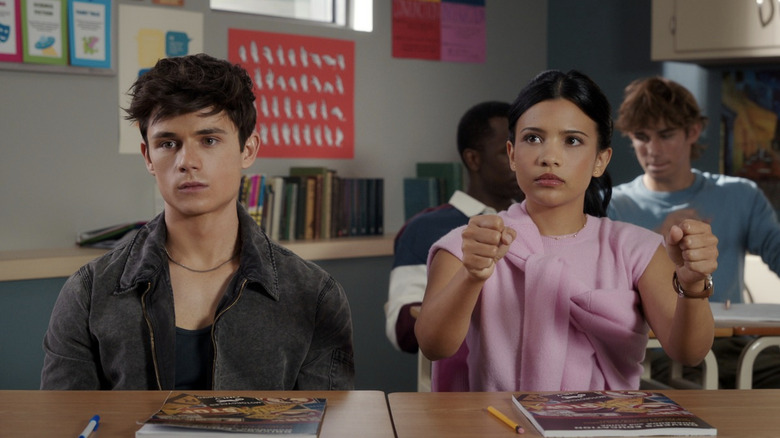 Ashby Gentry's Alex Walter sits alongside Nikki Rodriguez's Jackie Howard in a classroom in My Life with the Walter Boys