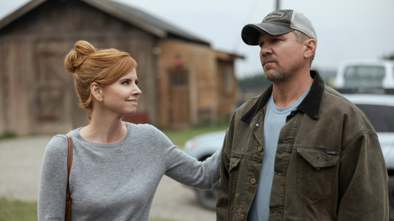 Sarah Rafferty's Katherine Walter puits her hand on Marc Blucas' George Walter's arm in My Life with the Walter Boys