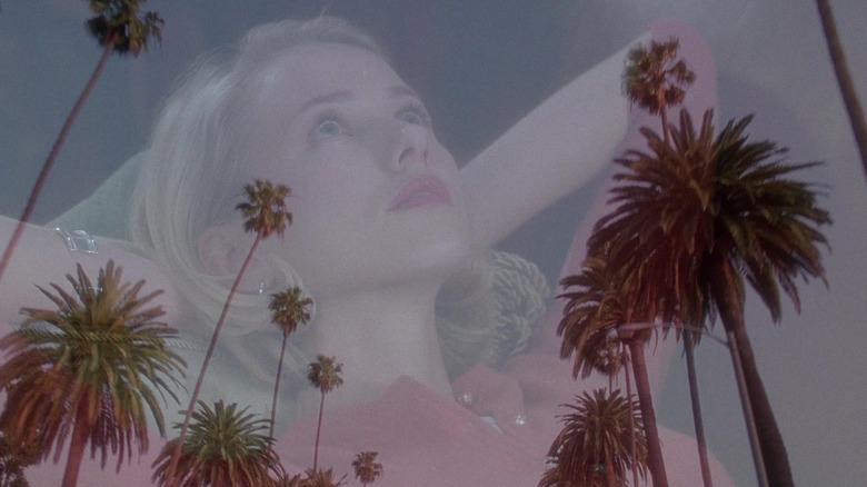A fade between a relaxing Betty and a few palm trees in Mulholland Drive