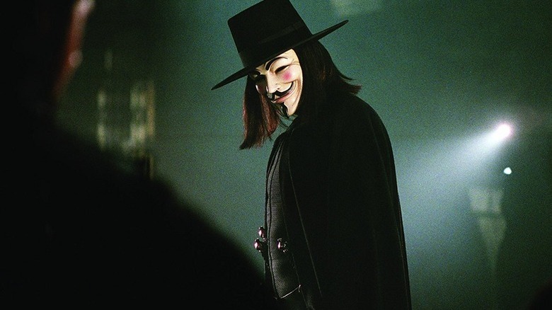 V standing in a dark room in "V for Vendetta"