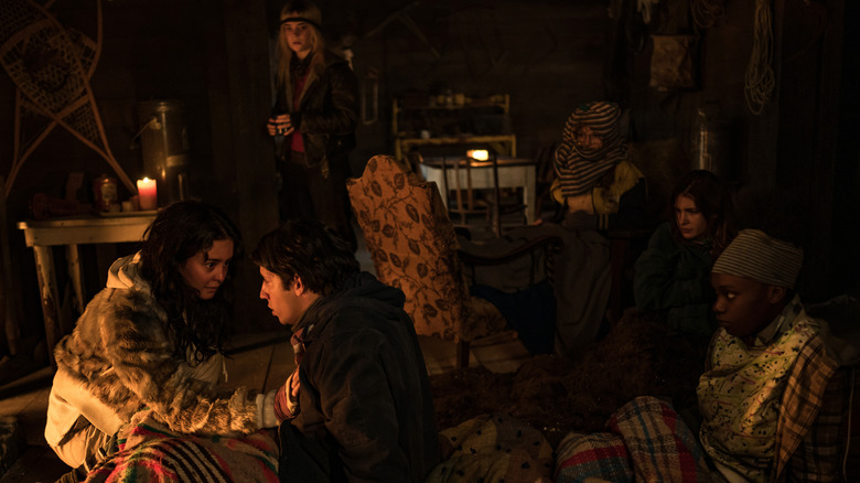 Yellowjackets season 2 flashback Lottie consoling Travis Natalie in background watching
