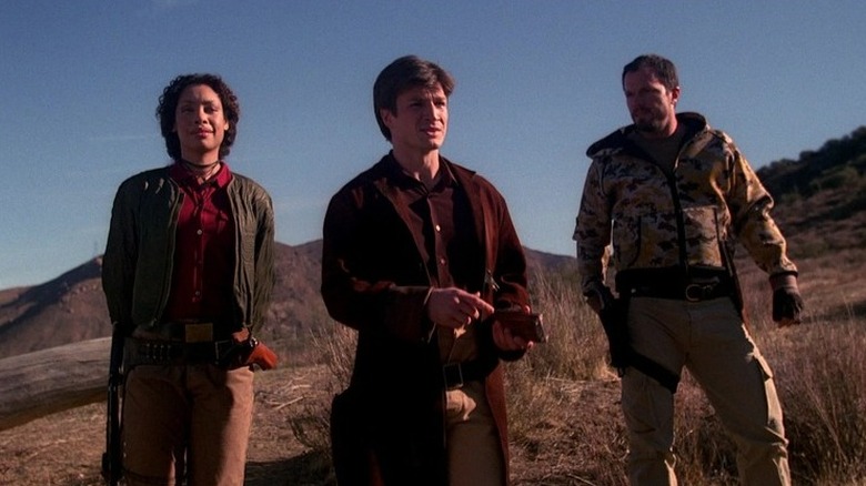 Firefly: Zoe, Mal, and Jayne on a hill