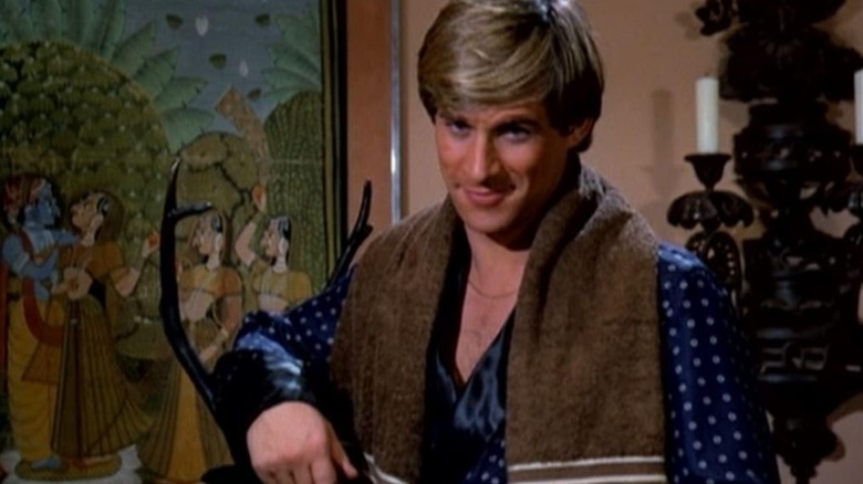 Simon MacCorkindale looks suave in a bathrobe and towel as Jonathan Chase in Manimal