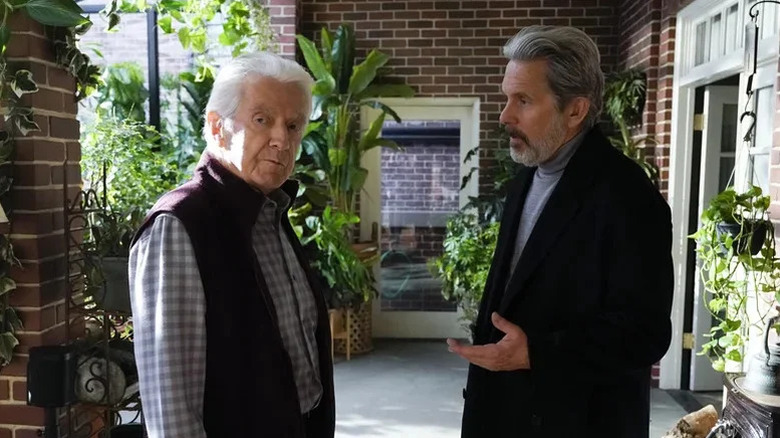 Francis X. McCarthy's Roman Parker and Gary Cole's Alden Parker standing and talking on NCIS