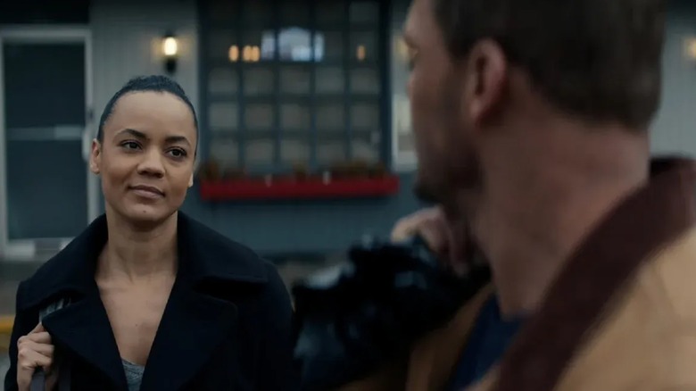 Neagley looking at Reacher in Reacher