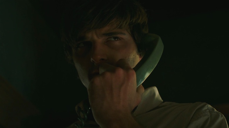 Jacob Elordi looking concerned on the phone in The Mortuary Collection