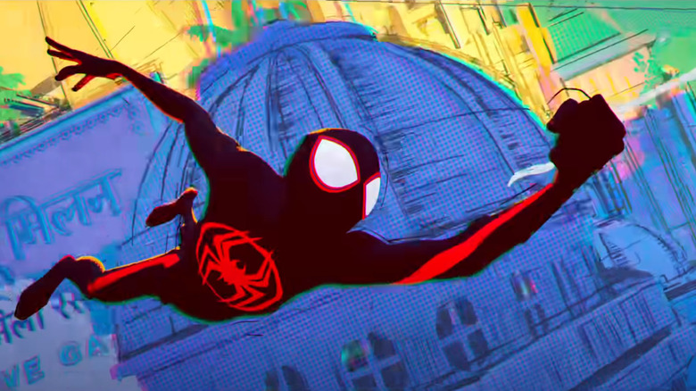 Spider-Man (Miles Morales) swings through the city