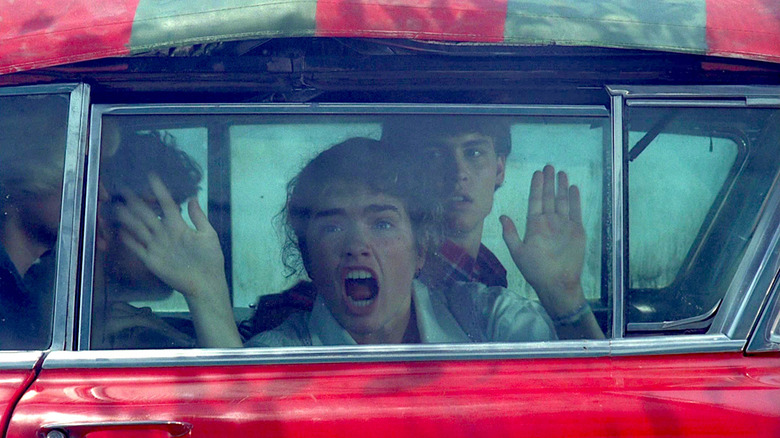 Nancy screams while trapped in a Freddy Krueger car