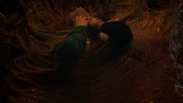 Holly Wheeler trapped in vines on "Stranger Things"