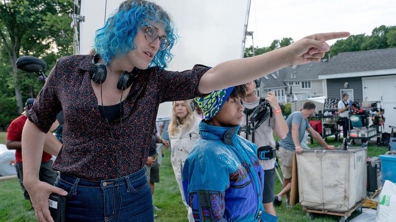 Jane Schoenbrun directing several of the cast and crew on the set of I Saw the TV Glow