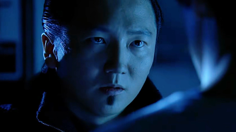 A version of Hiro from the future bathed in blue light in Heroes