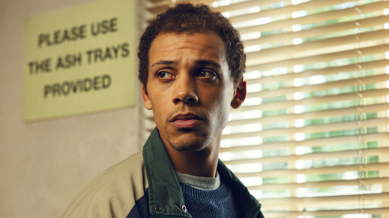 Jordan Bolger's André Hanscombe stands by a window in The Witness