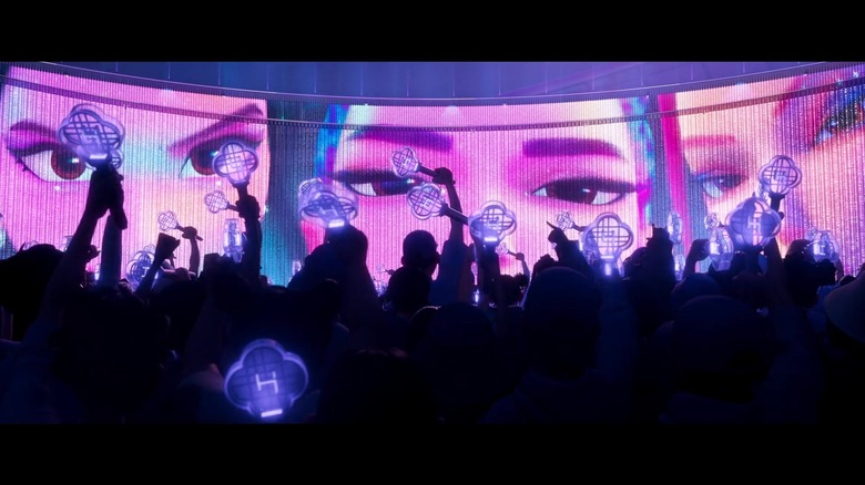 The audience getting ready to watch Huntr/x perform on stage in KPop Demon Hunters