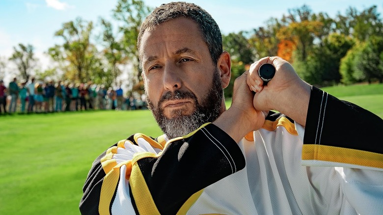 Adam Sandler as Happy Gilmore holding his golf club over his shoulder in Happy Gilmore 2