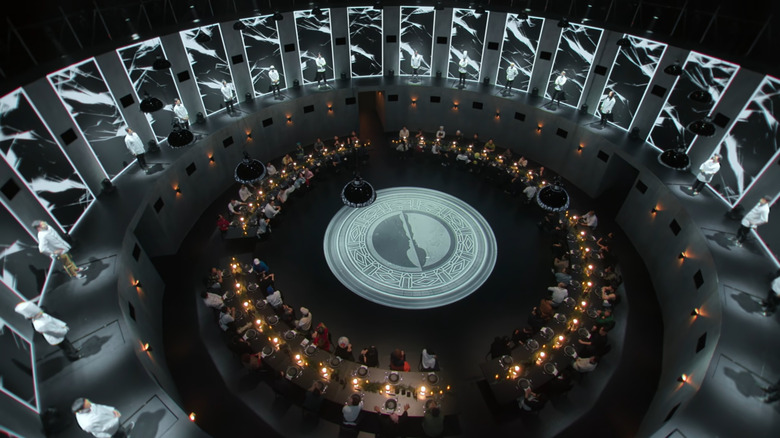 Round table of cooks surrounded by master chefs on Culinary Class Wars