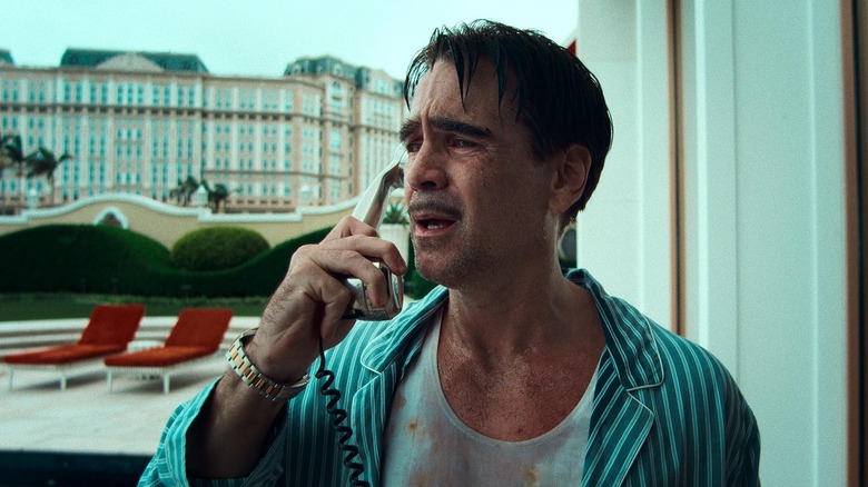 Colin Farrell as Lord Doyle looks distraught on the phone in Ballad of a Small Player