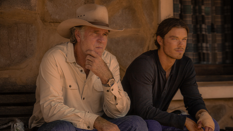 Robert Taylor as Colin Lawson and Sam Corlett as Marshall Lawson sitting together pensively on Territory