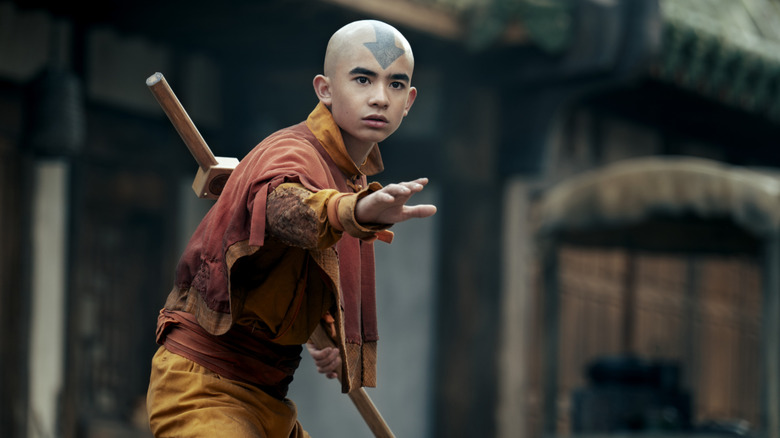 Gordon Cormier as Aang extending his arm in a fighting pose in Avatar: The Last Airbender