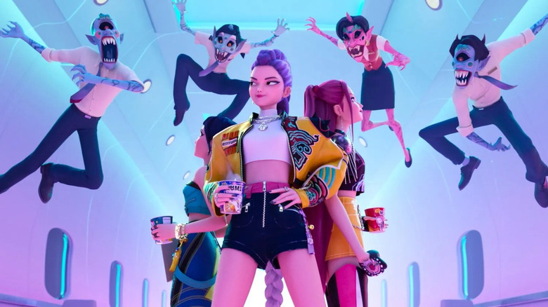 Rumi smirks as she looks over her shoulder at four demons flying through the air to attack her and her comrades Zoey and Mira in "KPop Demon Hunters"