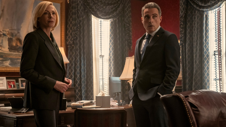 Allison Janney as President Grace Penn standing in a White House room next to Rufus Sewell as Vice President Hal Wyler in The Diplomat