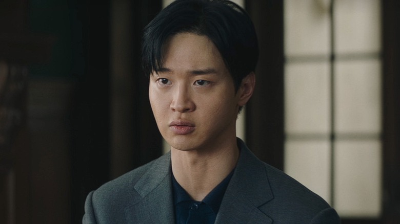 Cha Soo-yeol looks conflicted while speaking to a suspect in Queen Mantis