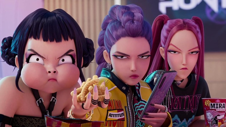 Huntr/x staring angrily with various items in their hands in KPop Demon Hunters